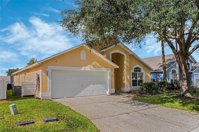 view of front facade featuring a front yard and a garage