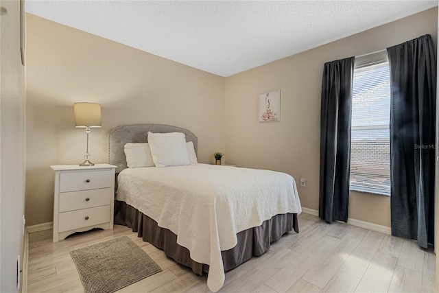 bedroom featuring light wood-type flooring