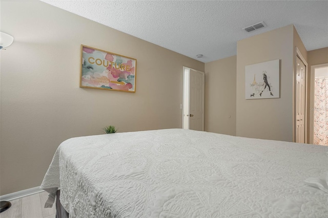 bedroom with a textured ceiling