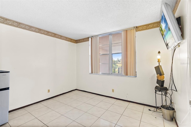 spare room with a textured ceiling