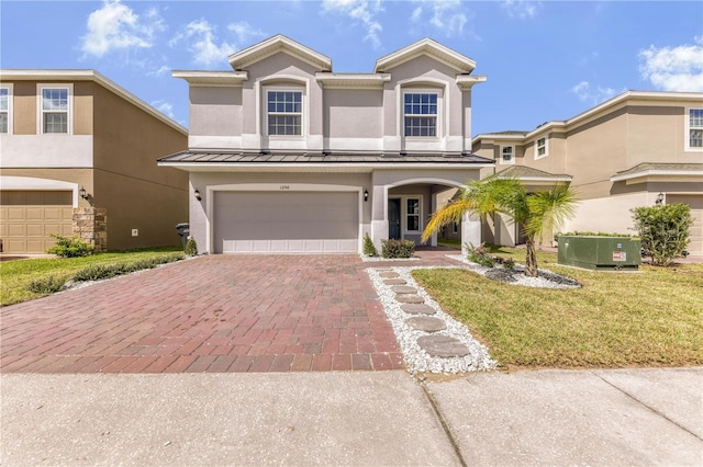 view of front facade with a front lawn and a garage