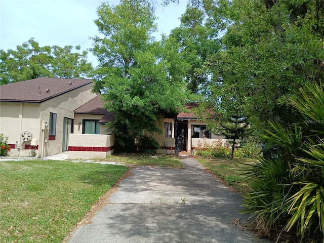 view of front of home with a front yard