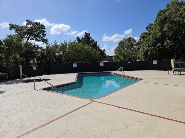 view of pool featuring a patio