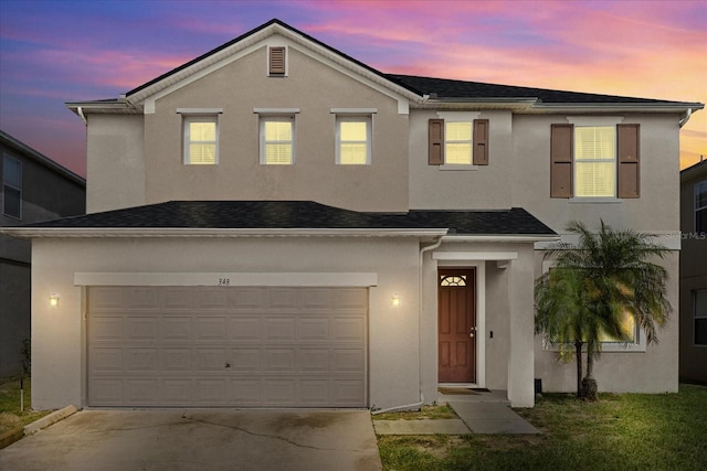 view of front of property with a garage