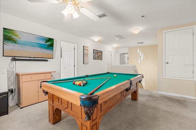 recreation room with pool table, light colored carpet, a textured ceiling, and ceiling fan