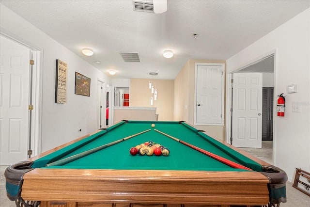 playroom featuring carpet flooring, billiards, and a textured ceiling