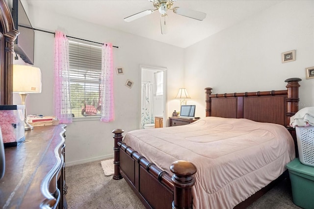 bedroom with ceiling fan, connected bathroom, and light carpet