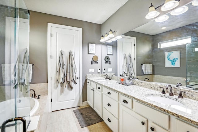 bathroom with vanity, tile patterned flooring, and plus walk in shower