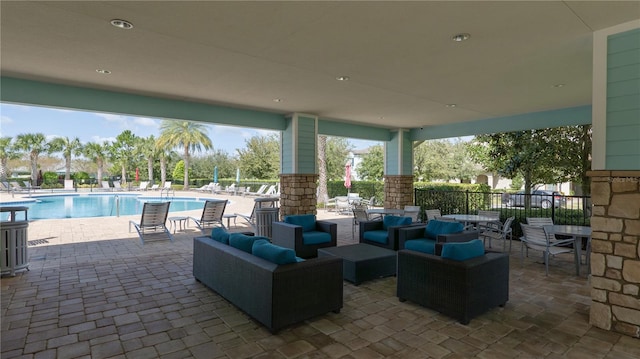 view of patio / terrace with a community pool and an outdoor hangout area