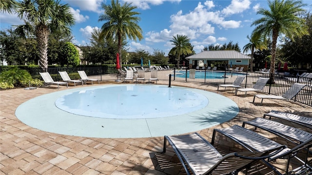 view of pool featuring a patio area