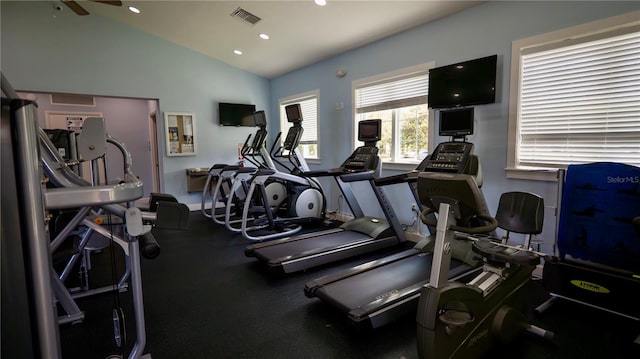 workout area with ceiling fan and vaulted ceiling