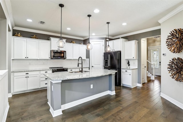 kitchen featuring dark hardwood / wood-style floors, sink, black appliances, decorative light fixtures, and white cabinetry