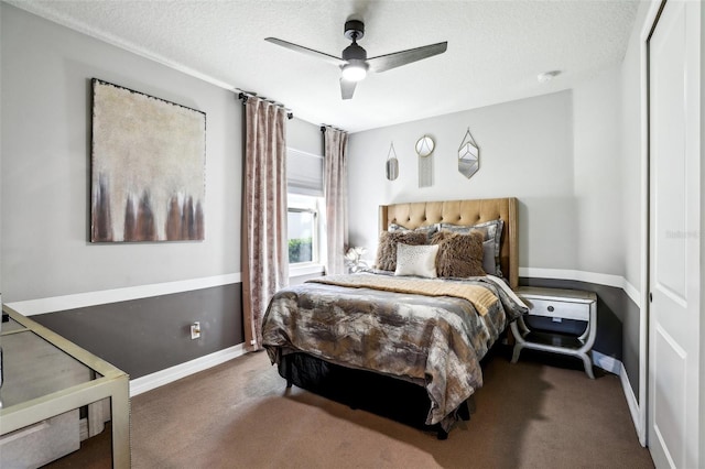 carpeted bedroom featuring a closet, a textured ceiling, and ceiling fan