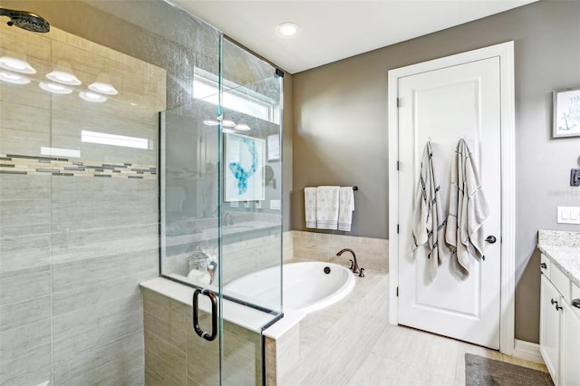 bathroom featuring vanity, separate shower and tub, and tile patterned flooring