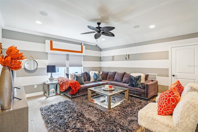 living room featuring ceiling fan, carpet, lofted ceiling, and ornamental molding