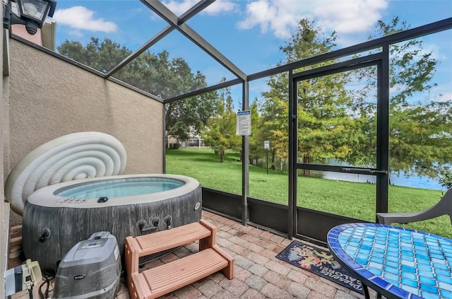 sunroom featuring a jacuzzi