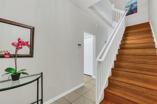 staircase with tile patterned flooring