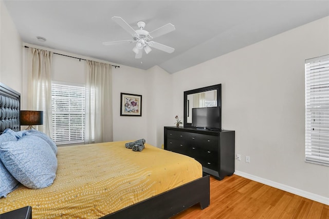 bedroom with ceiling fan and hardwood / wood-style floors