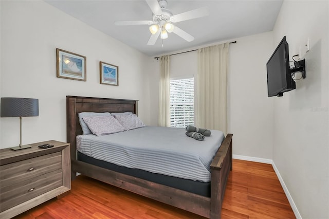 bedroom with wood-type flooring and ceiling fan