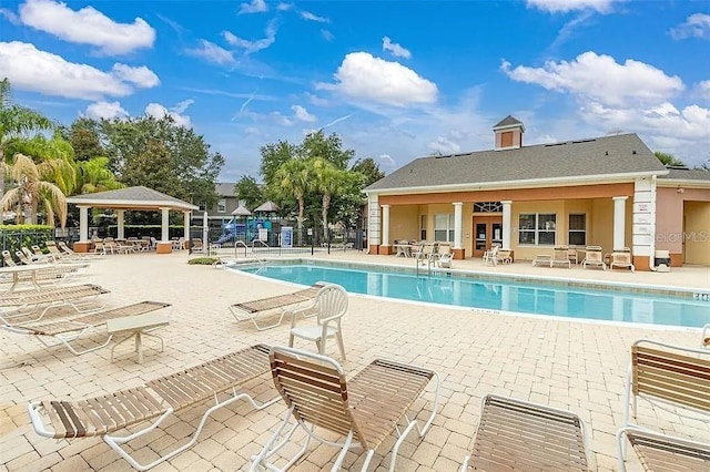 view of swimming pool featuring a patio and a gazebo