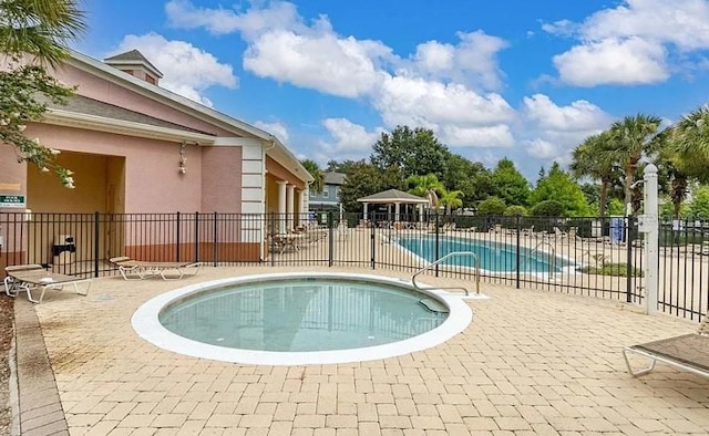 view of swimming pool featuring a patio area