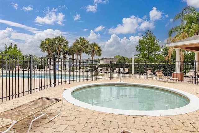 view of swimming pool with a patio area