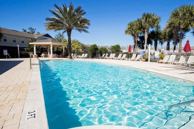 view of swimming pool featuring a gazebo and a patio