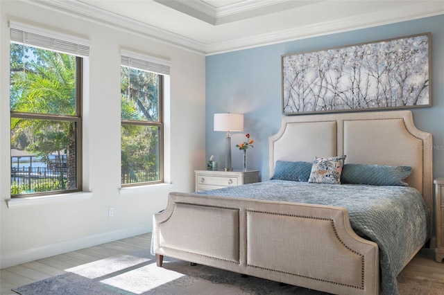 bedroom featuring hardwood / wood-style flooring and ornamental molding