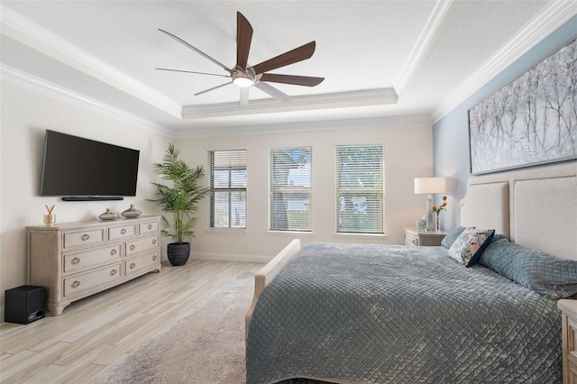 bedroom featuring ceiling fan, light hardwood / wood-style floors, and crown molding