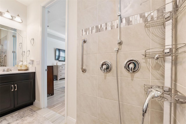 bathroom featuring vanity and a tile shower