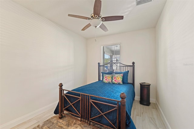 bedroom featuring hardwood / wood-style flooring and ceiling fan