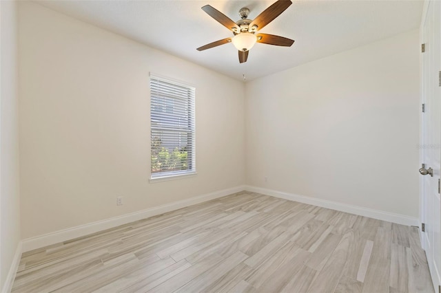 spare room featuring ceiling fan and light wood-type flooring