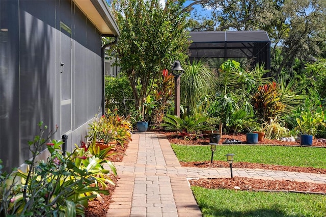 view of yard with glass enclosure