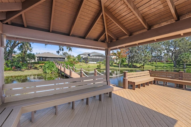 view of dock featuring a deck with water view