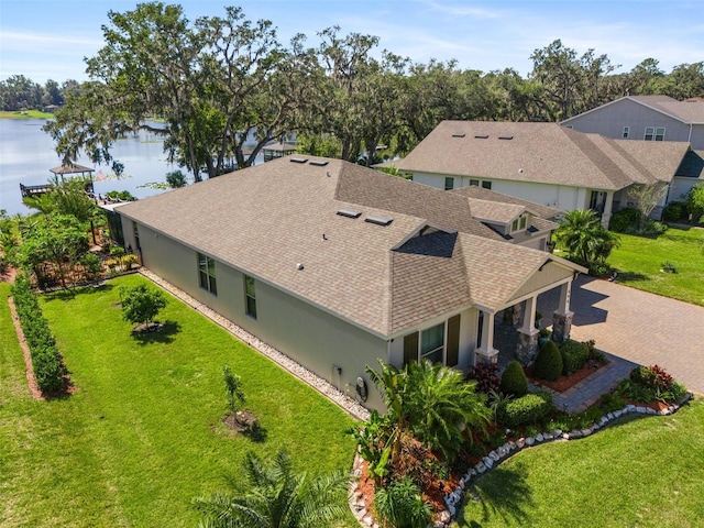 drone / aerial view featuring a water view