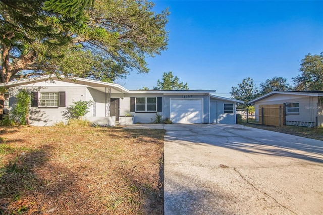 single story home featuring a garage