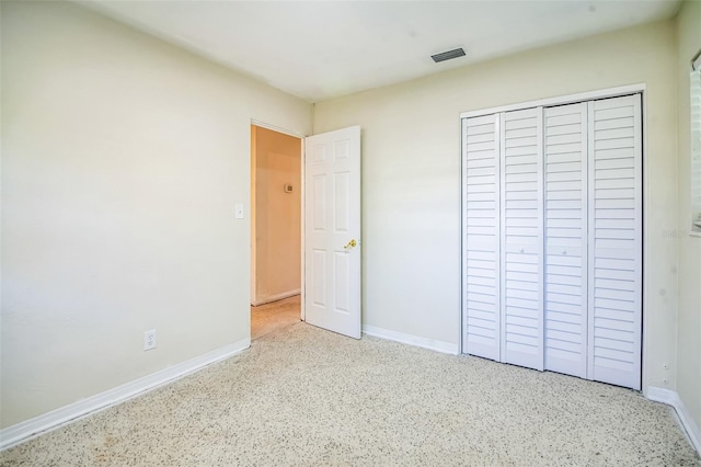 unfurnished bedroom featuring a closet