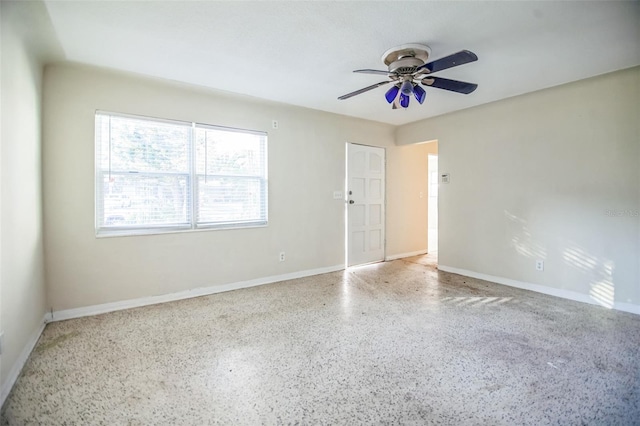 empty room featuring ceiling fan