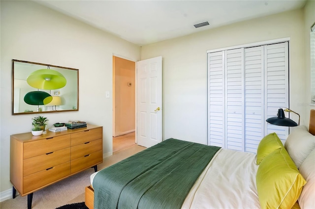 carpeted bedroom featuring a closet