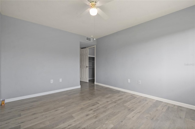 empty room featuring light hardwood / wood-style floors and ceiling fan