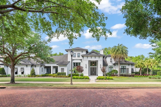 view of front of property with a front lawn