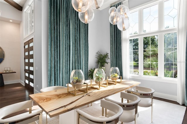 dining space with dark hardwood / wood-style floors