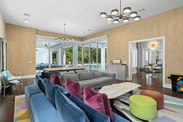 living room featuring dark wood-type flooring and a notable chandelier