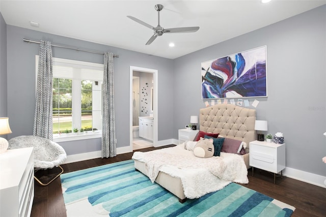 bedroom featuring dark hardwood / wood-style flooring, ensuite bathroom, and ceiling fan