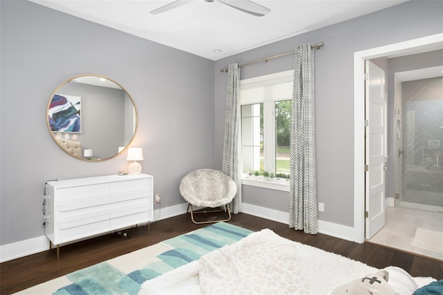 bedroom featuring connected bathroom, dark hardwood / wood-style floors, and ceiling fan