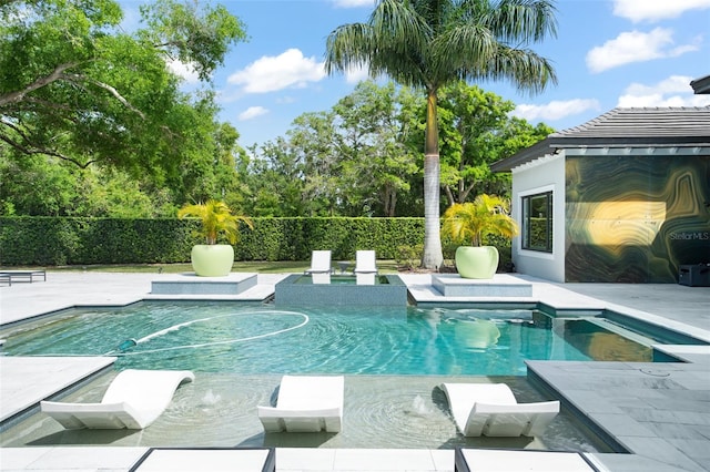 view of swimming pool featuring a patio and pool water feature