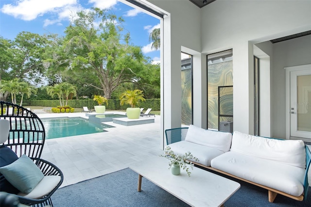 view of swimming pool with a patio area