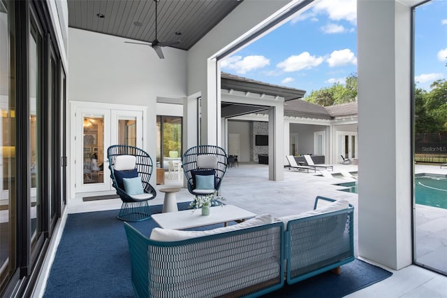 view of patio with a fenced in pool, french doors, and ceiling fan