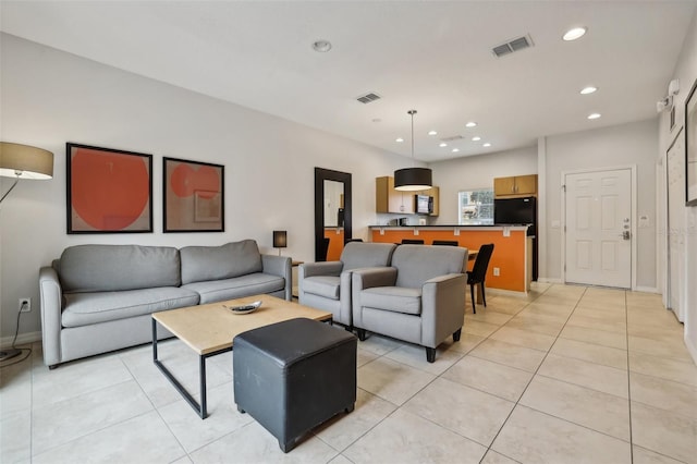 living room featuring light tile patterned flooring