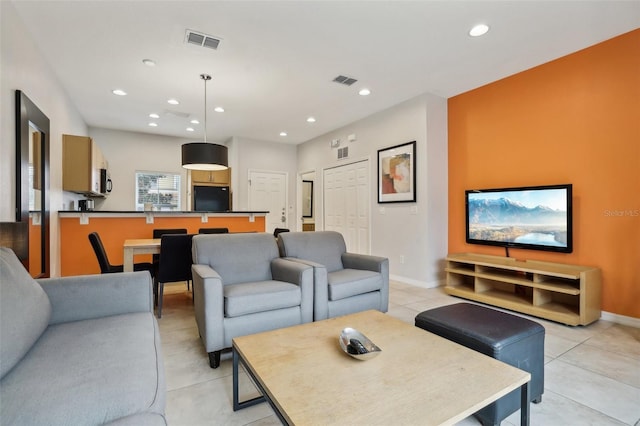 living room with light tile patterned floors